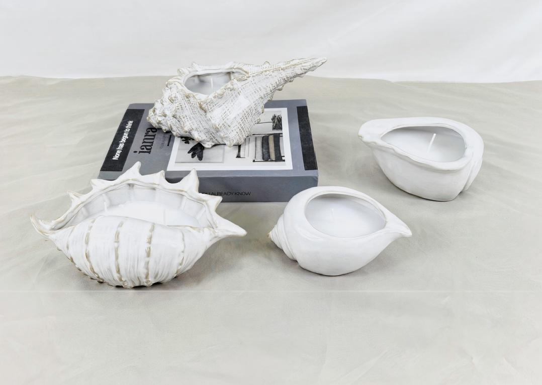 Người giữ nến có nhiều dạng. Bạn đã bao giờ nhìn thấy một cái có hình dạng giống vỏ sò chưa?